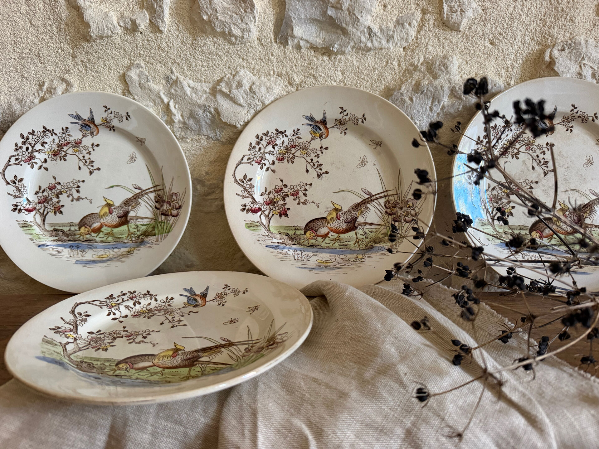 Polychrome ironstone dessert plates from Digoin and Sarreguemines.