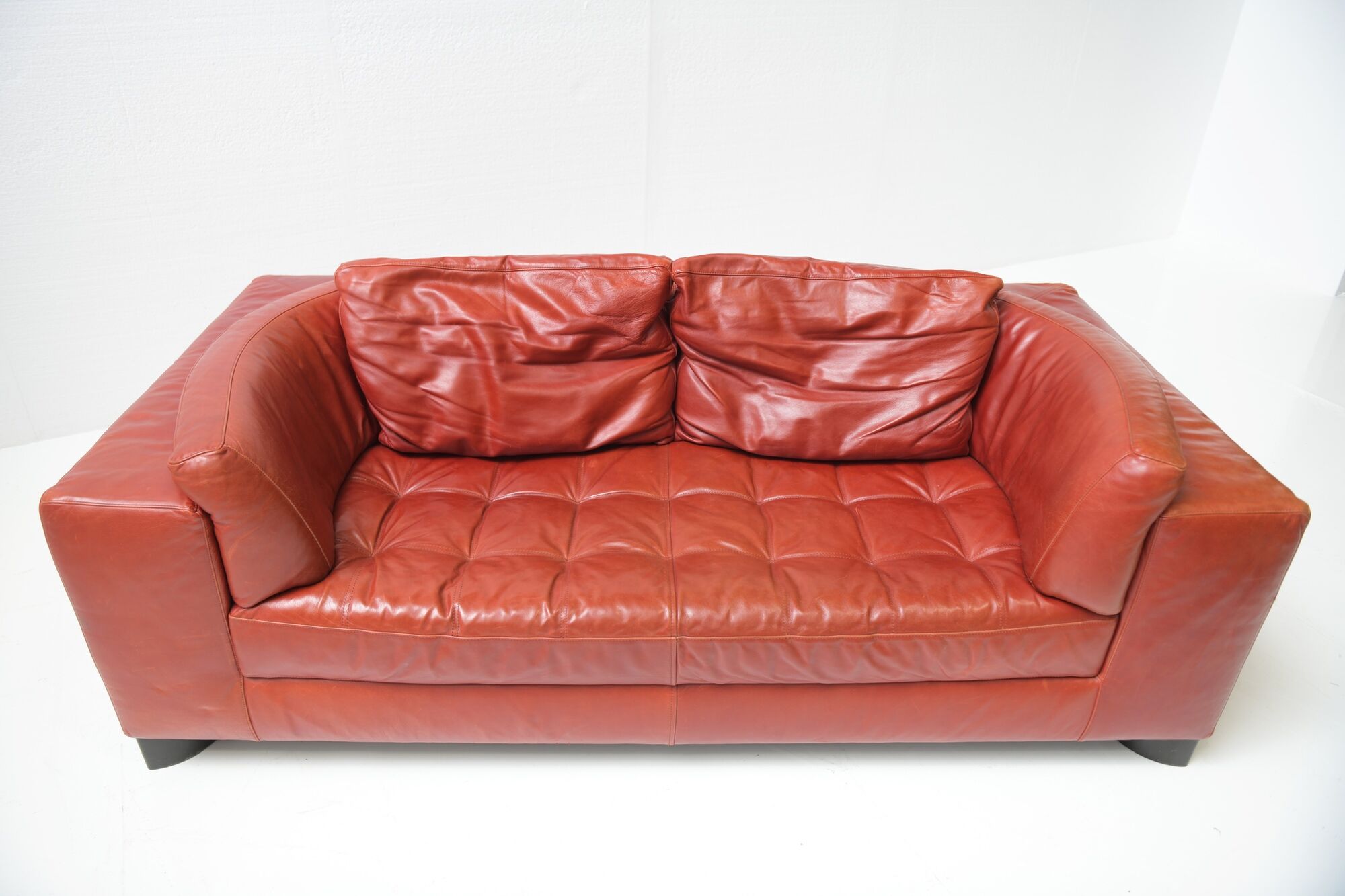 Vintage Osaka loveseat in oxblood leather by Natuzzi Italy