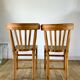 Pair of bistro chairs in light curved wood and green seat 1950s