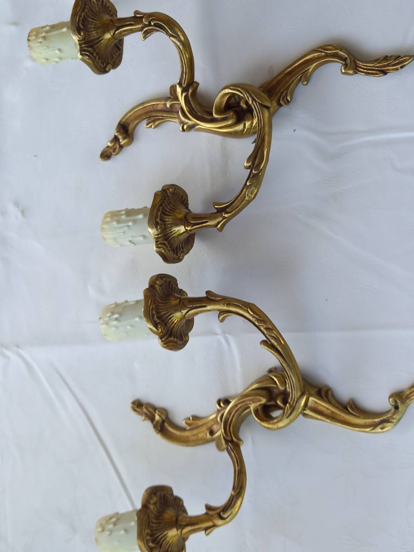 Old pairs of bronze wall sconces