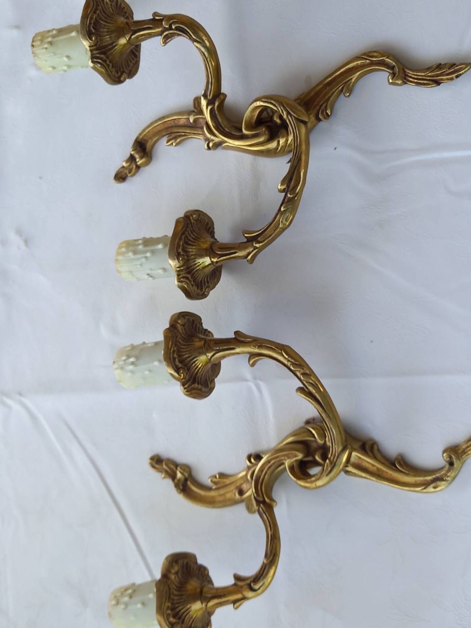 Old pairs of bronze wall sconces
