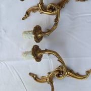 Old pairs of bronze wall sconces