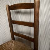 Set of wooden and straw chairs