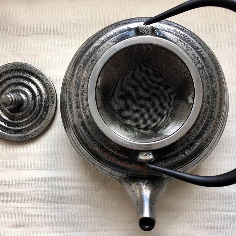 Silver cast iron teapot