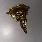 Antique wall-mounted console in gilded wood in rococo style.