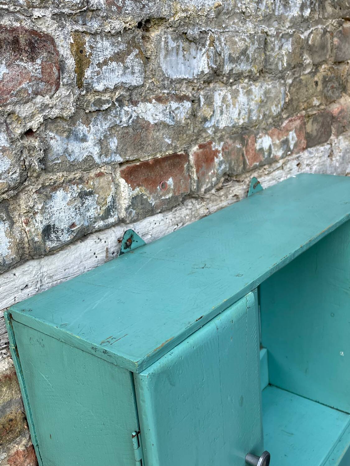 Old wall-mounted bathroom cabinet