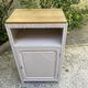Beautiful art deco jam cupboard in delicate beige tone / and wicker basket