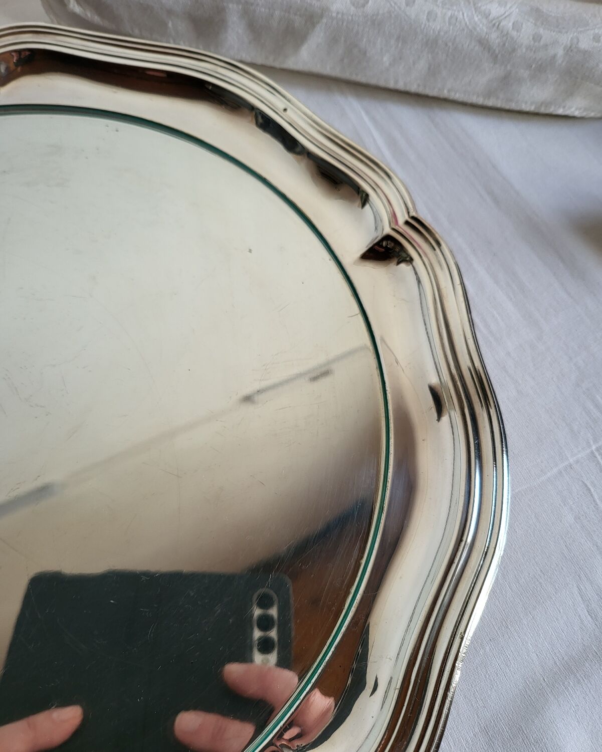 Round silver-plated serving dish with a glass base.
