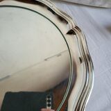 Round silver-plated serving dish with a glass base.