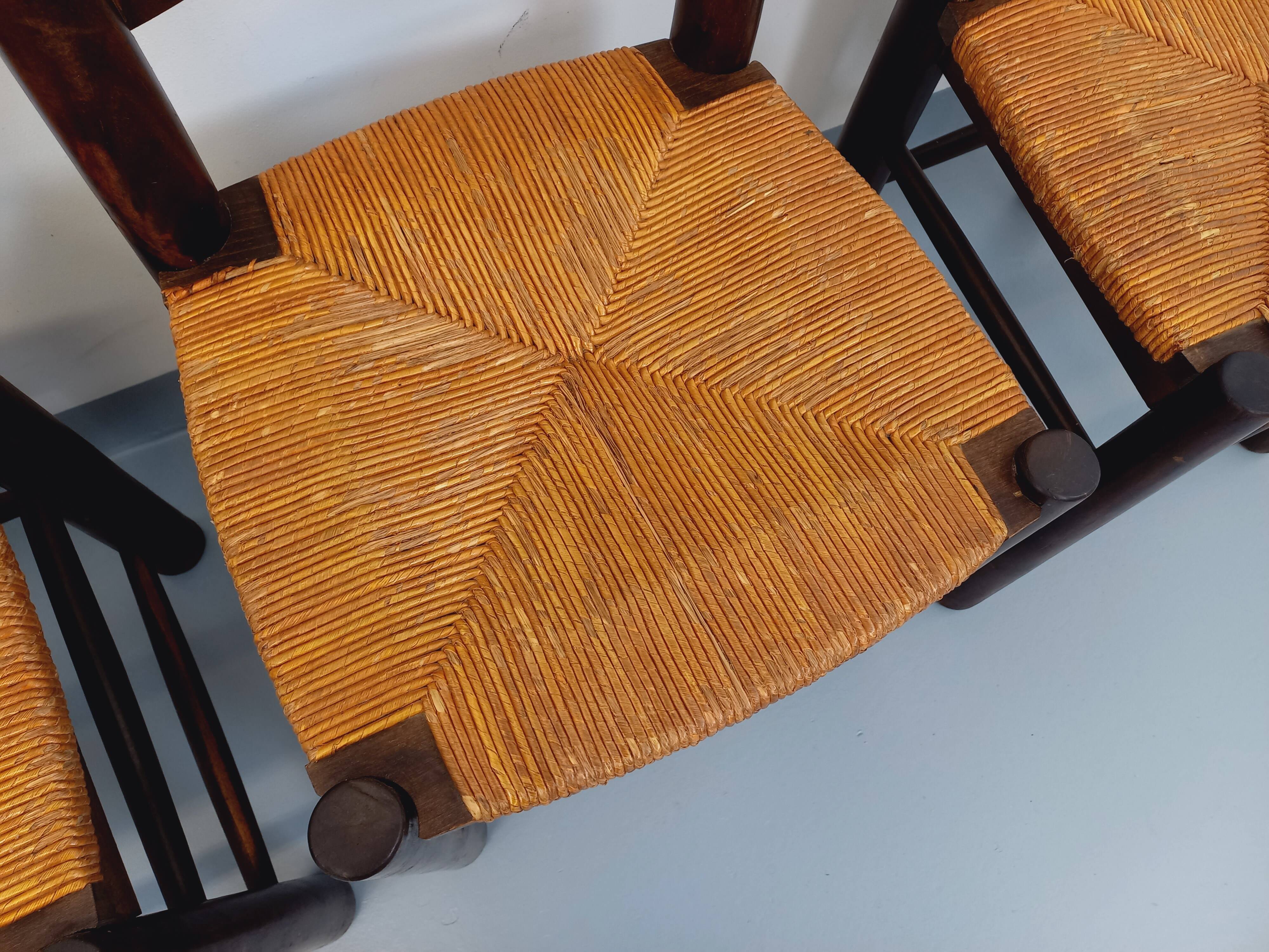 Set of 4 vintage brutalist chairs by Georges Robert in wood and straw.