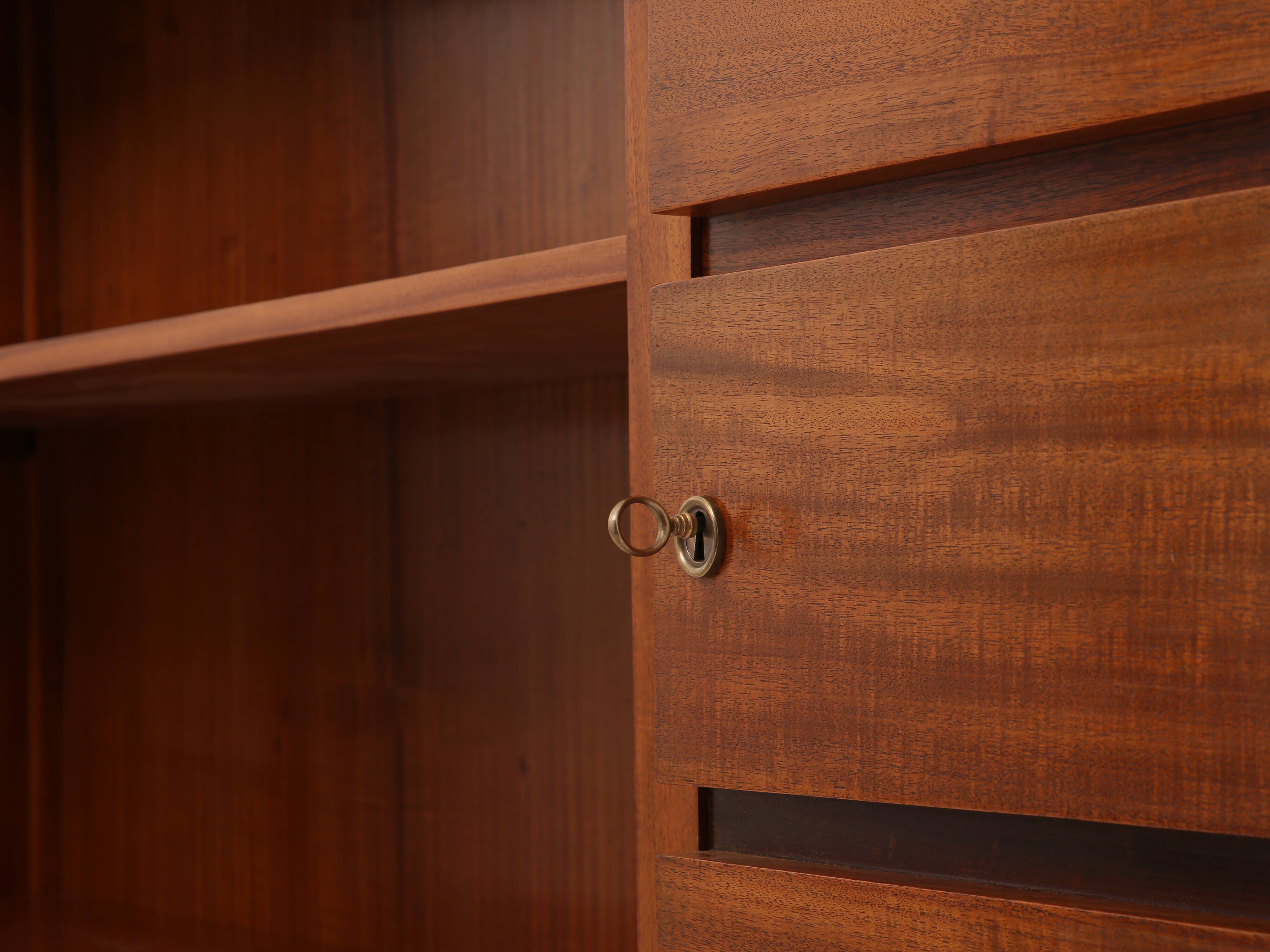 Large modernist cabinet with two doors in mahogany from around 1940.