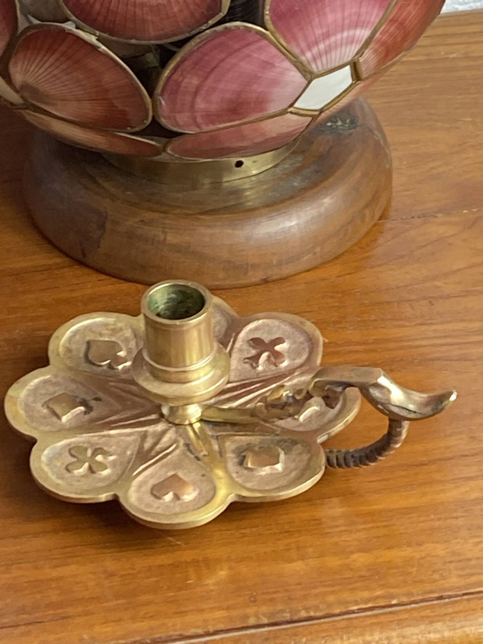 Handheld candlestick in bronze, card game decoration