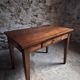 Old French table in cherry wood with bistro chair, circa 1900–1930.