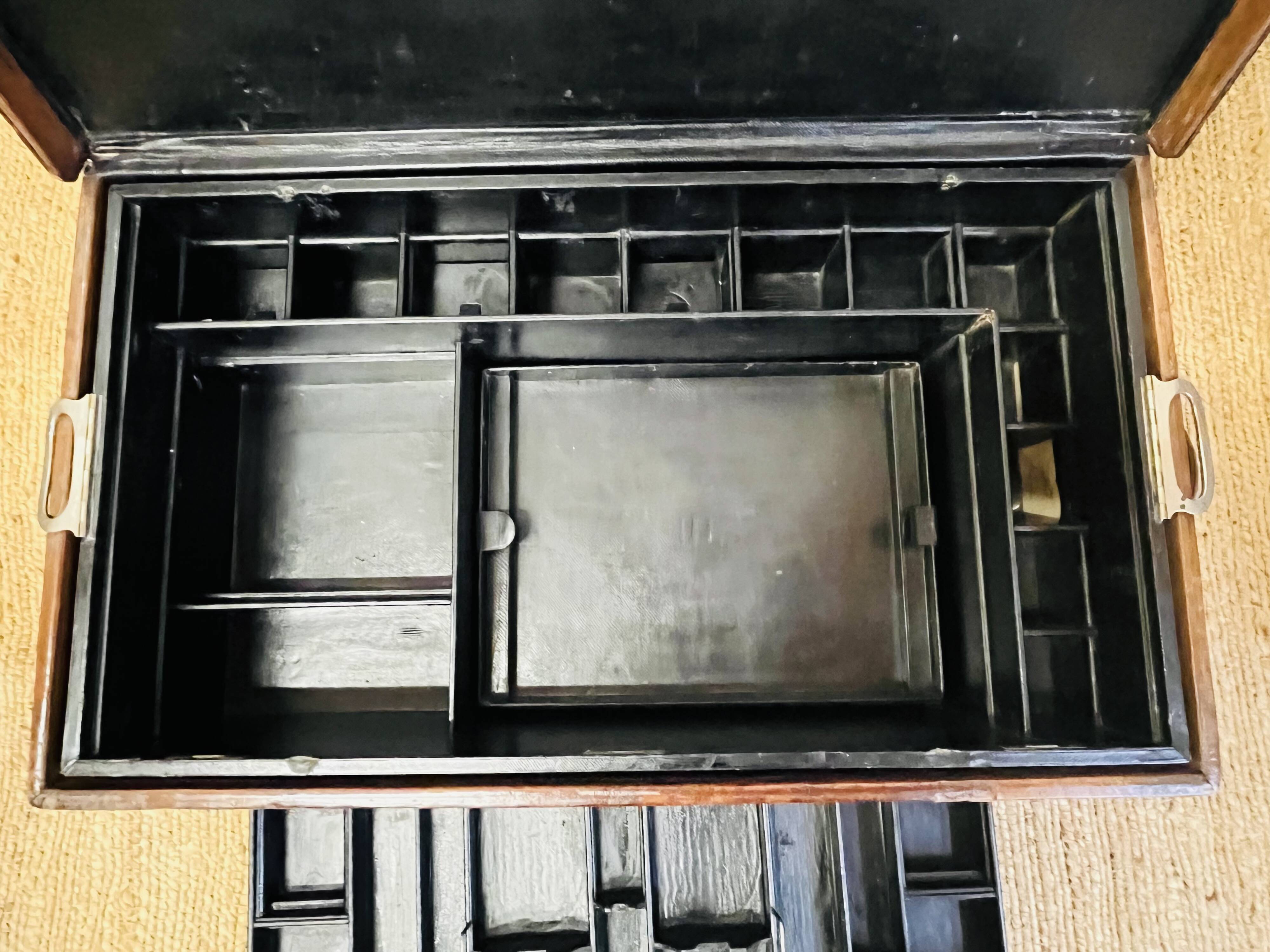 Large Gustave Keller leather trunk with multiple compartments