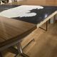 Extendable round table with a space age vintage mid-century formica top.