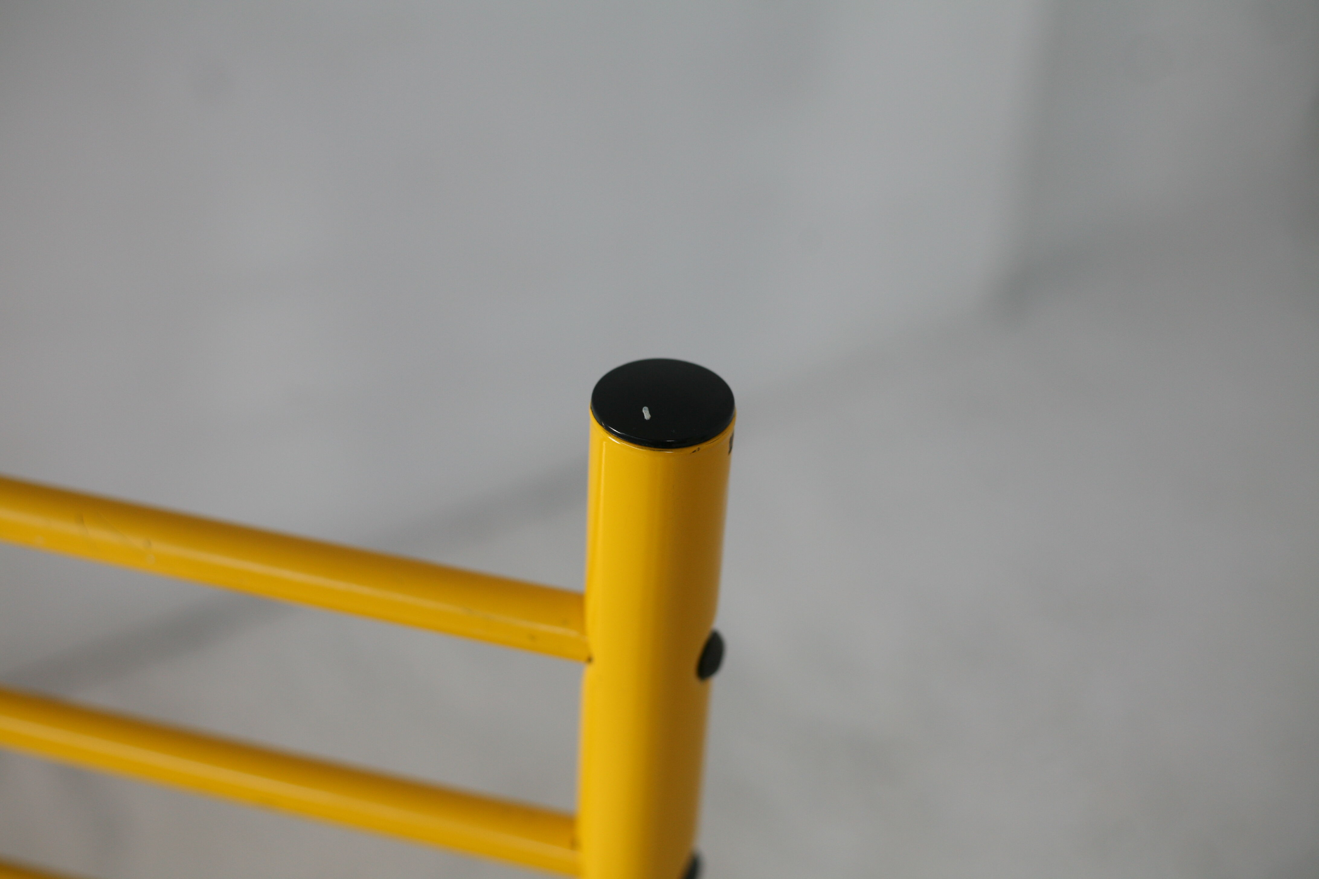 Adjustable seat chair. Circa 1980. Italy. Yellow lacquered steel.