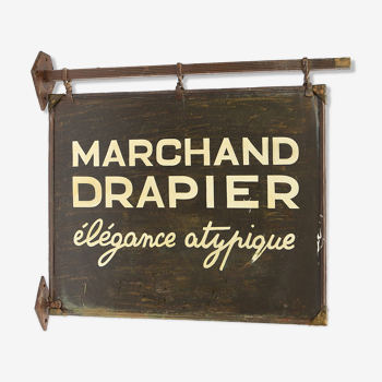 Former sign of the store "Marchand Drapier"