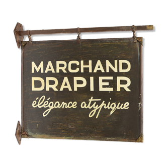 Former sign of the store "Marchand Drapier"