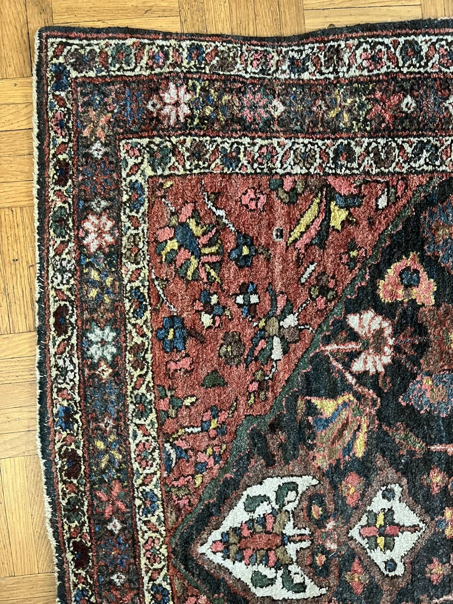 Antique handmade Hamadan Persian rug, ivory medallion on dark background 148x103.