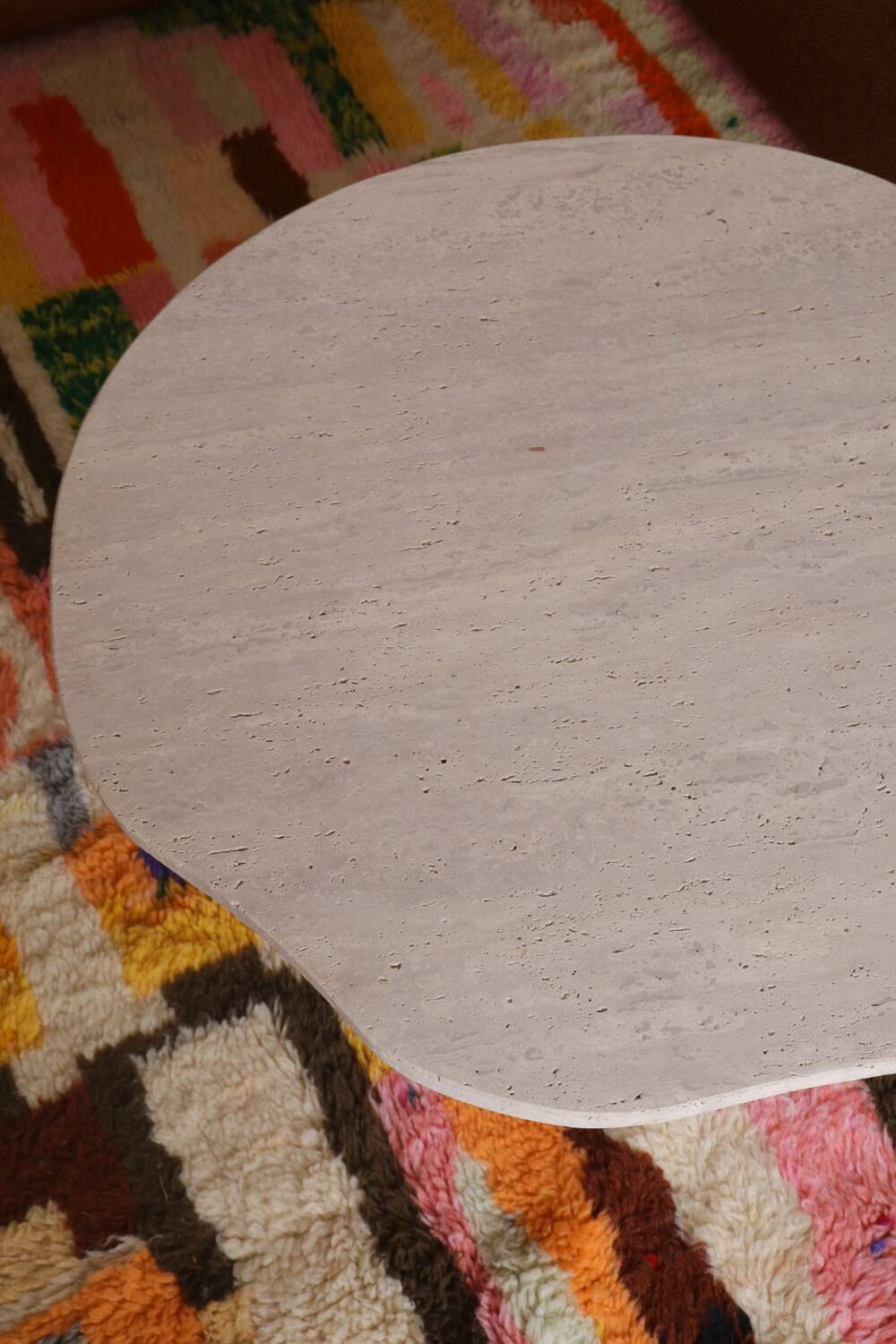 Organic shape travertine coffee table