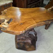 Sculpted olive wood table, made from a root.