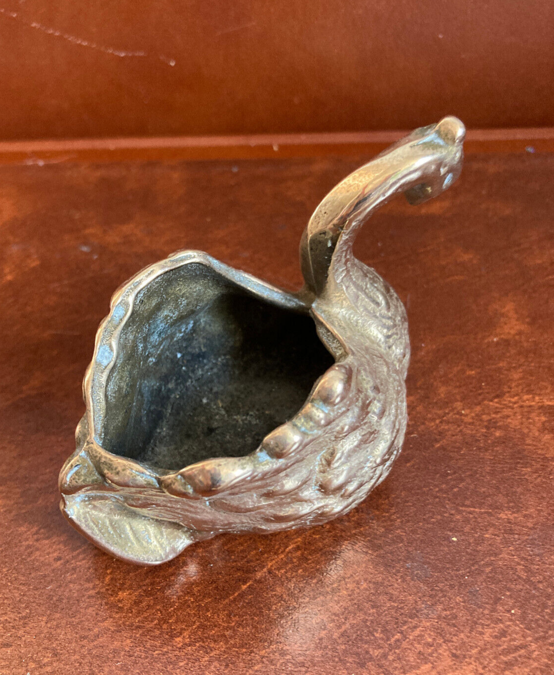 Empty pocket - bronze swan