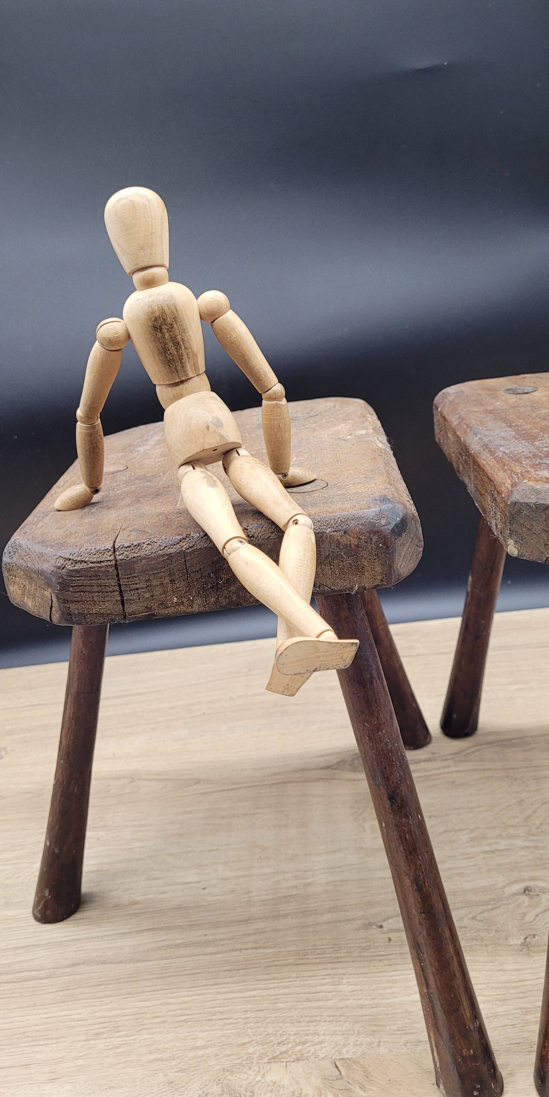 Pair of solid octagon cowhide tripod stools
