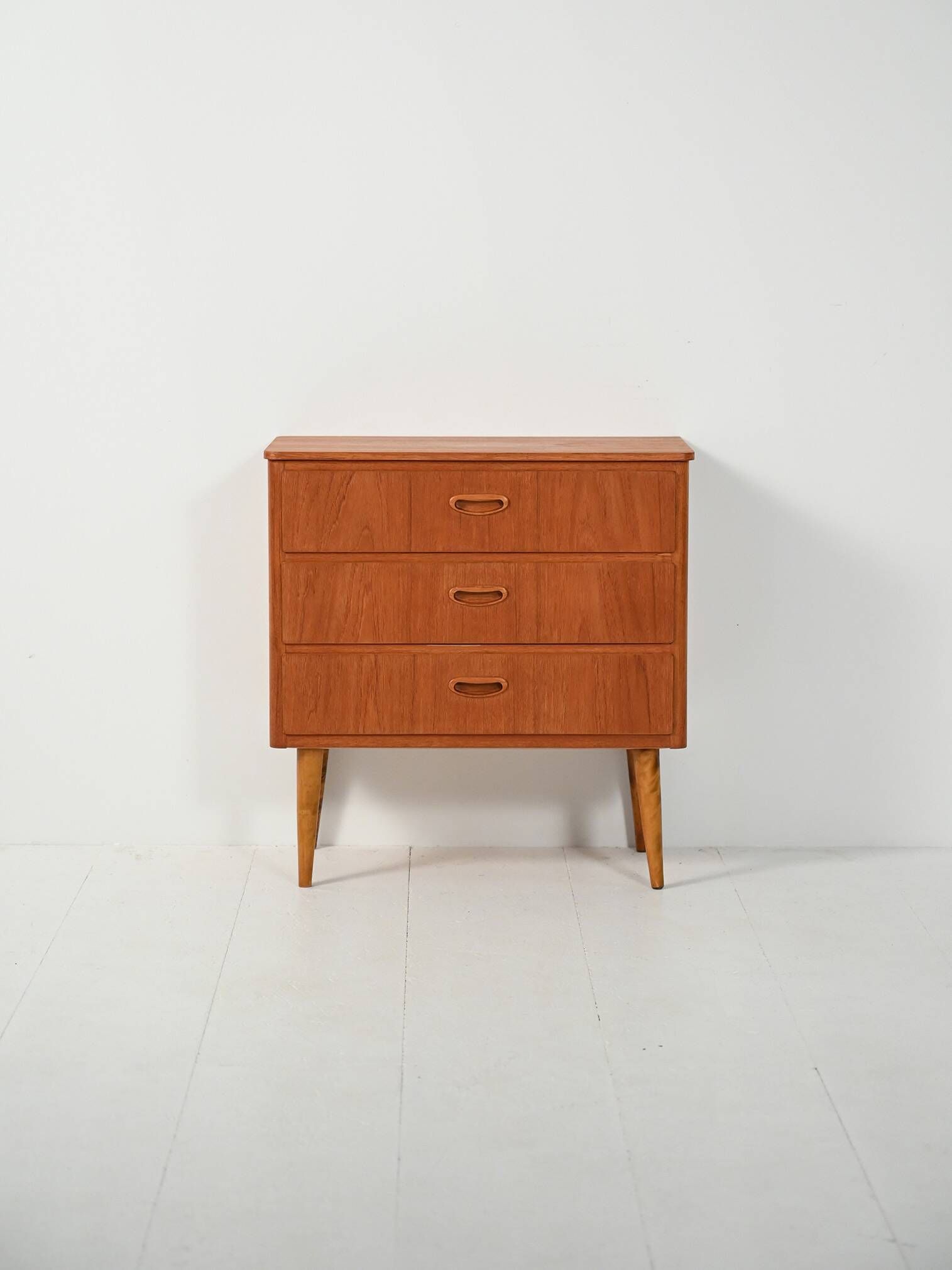 Scandinavian Chest of Drawers in teak with turned birch legs, 1950s