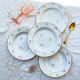 4 assiettes creuses l’amandinoise en porcelaine blanche dorées motif fleuris