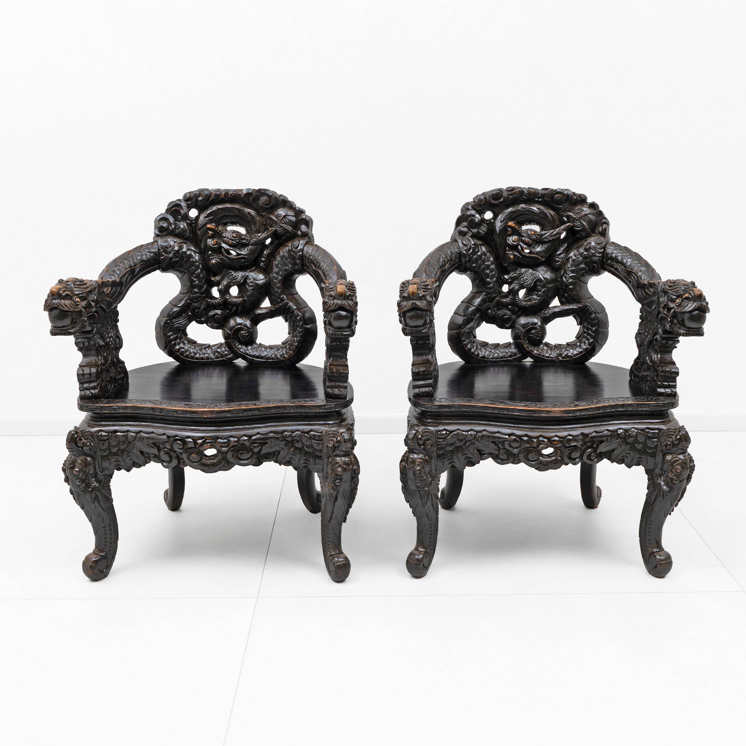Pair of Chinese Qing Dynasty Carved Dragon Armchairs,Ebonized Hardwood,19th
