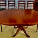 Round or oval table with four chairs in solid cherry, with extensions