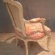 Louis XV style armchair upholstered with an Egyptian pattern.