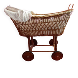 Vintage wicker cradle on wheels from the 1970s.