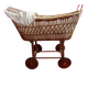 Vintage wicker cradle on wheels from the 1970s.