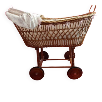 Vintage wicker cradle on wheels from the 1970s.