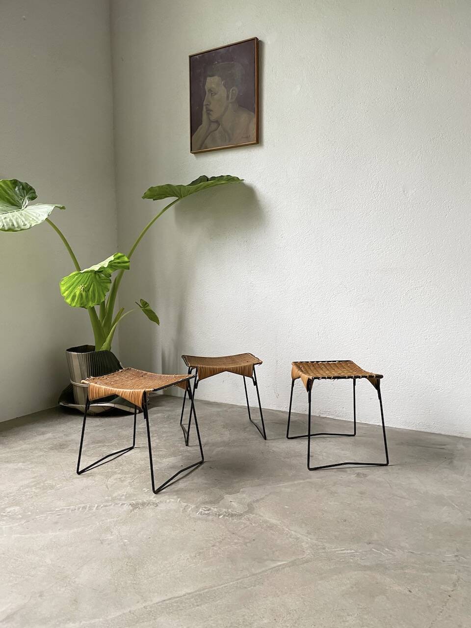 Set of three Raoul Guys wicker and metal stools