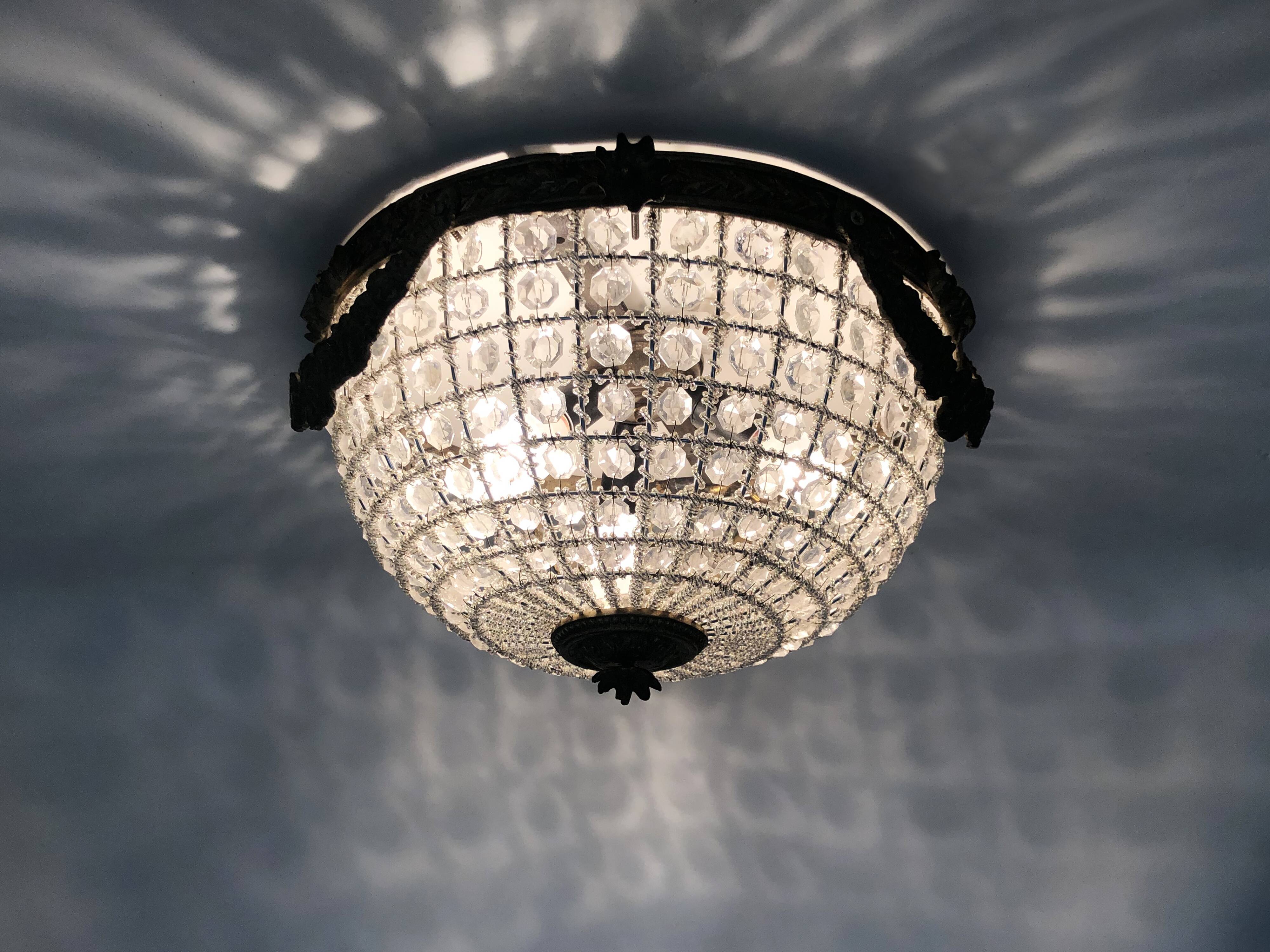 Half-basket ceiling light with 3 bronze lights and glass pendants. 1980s