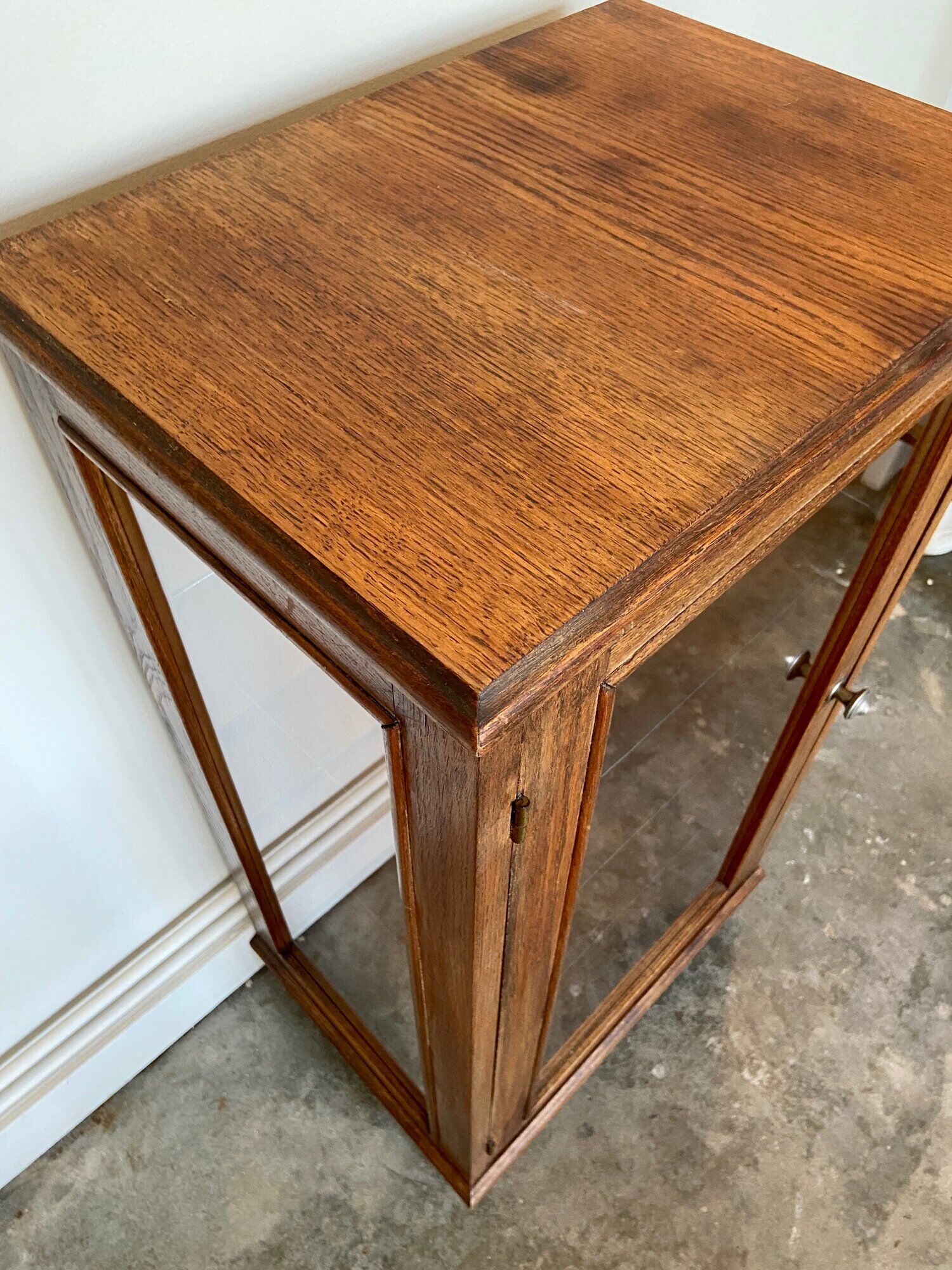 Dark wood display case and transparent glass