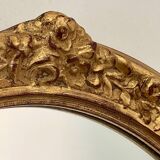 Oval mirror in carved wood