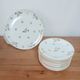 Dessert service, 10 plates and 1 pie dish, in Limoges Porcelain, white and gold