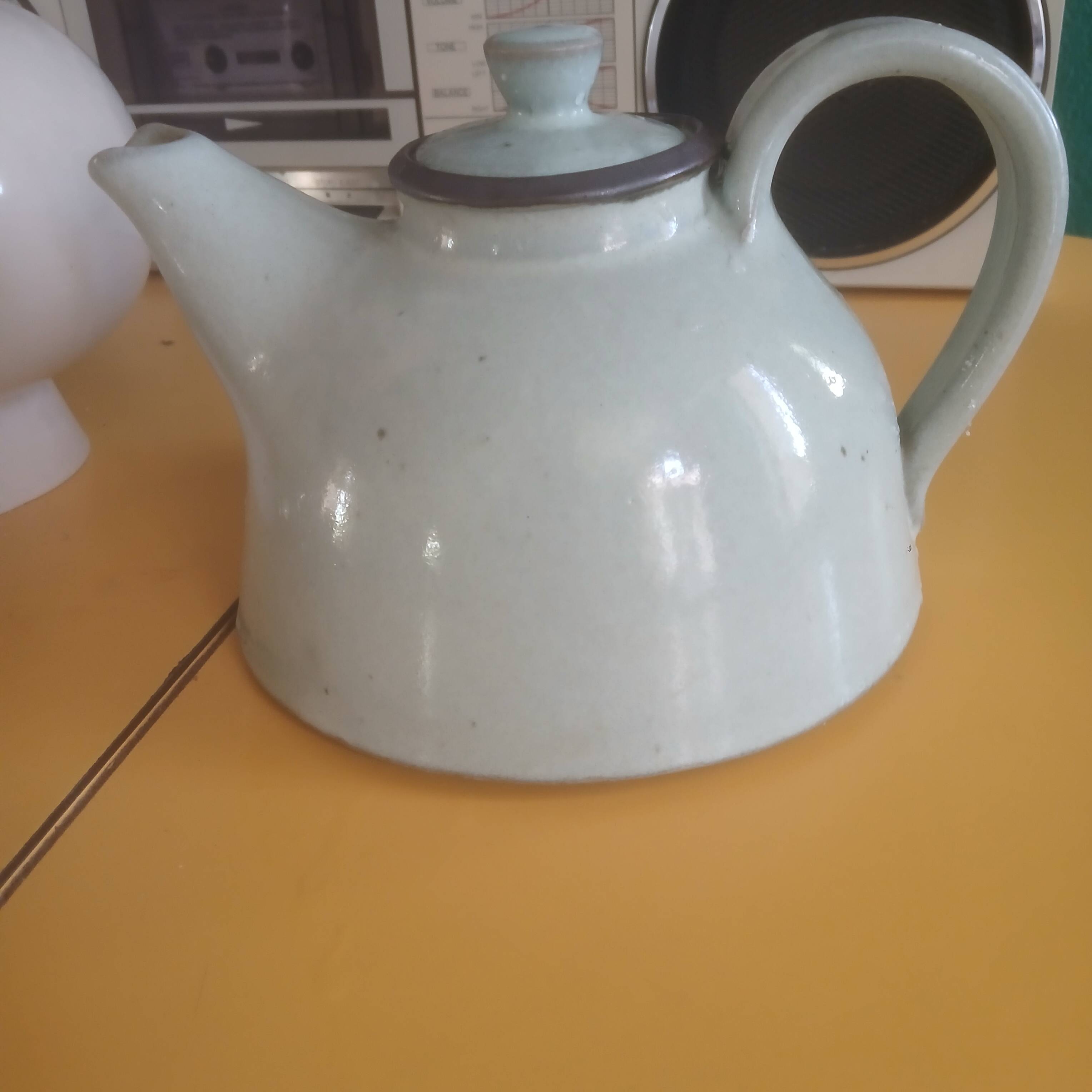 Vintage artisanal style glazed pottery teapot