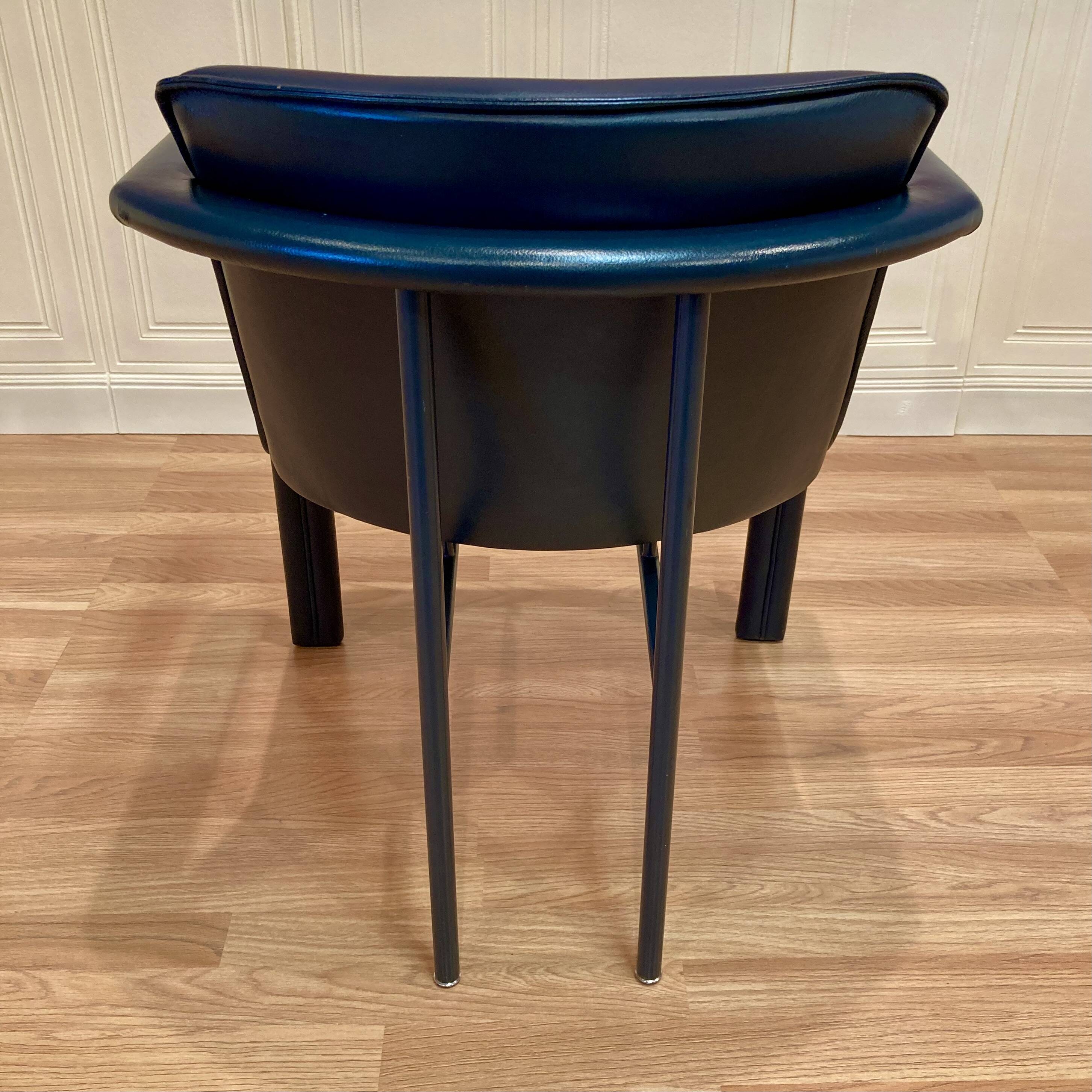 Set of 3 designer leather and metal armchairs.