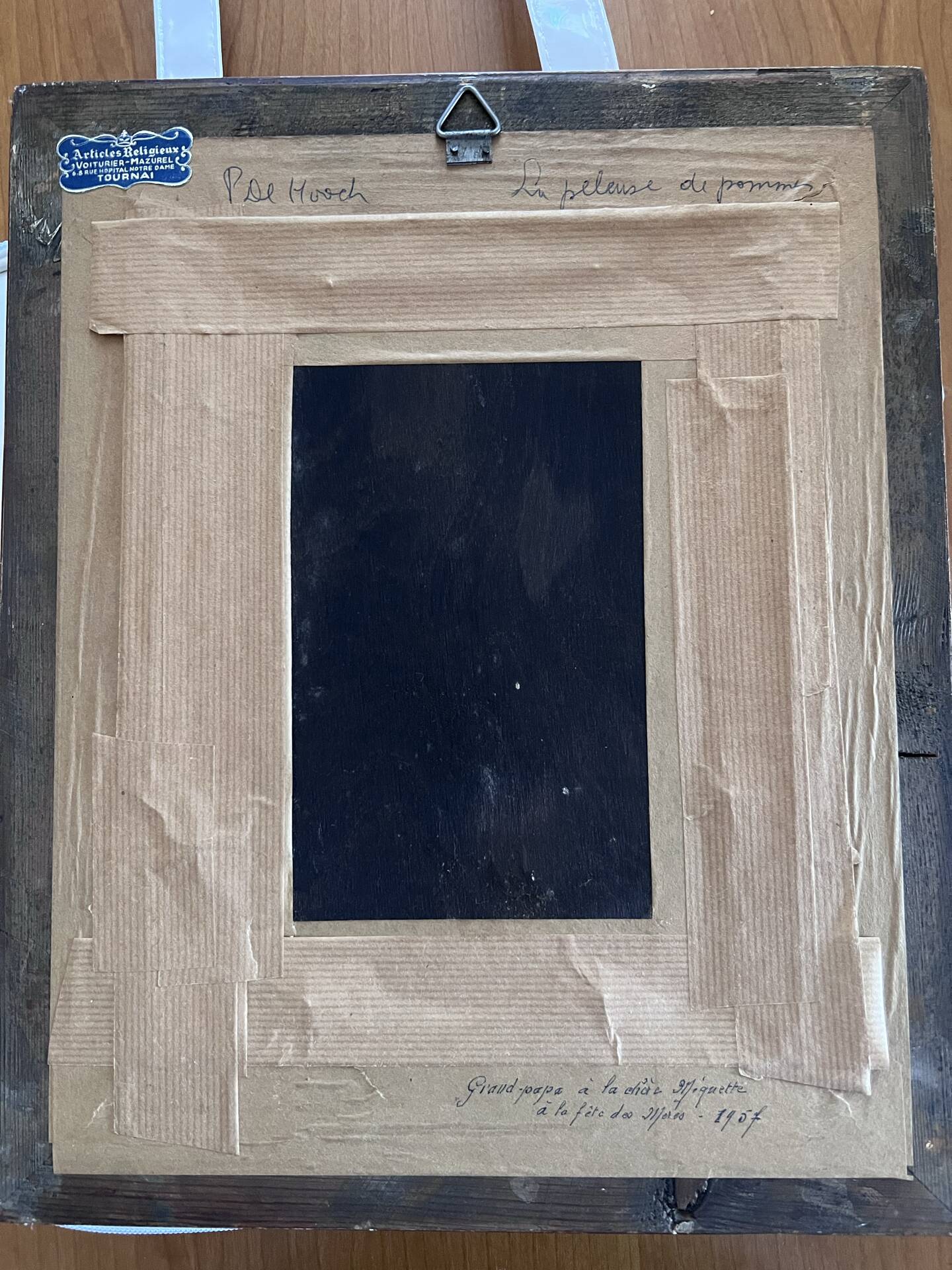 Framed reproduction painting with a golden frame.