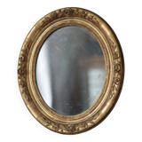 Oval wall mirror with gilded frame and mercury glass. Late 19th-early 20th century.