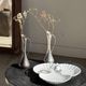 Vintage silver-plated soliflore vase in the shape of a ewer with a slender handle.