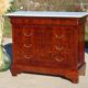 Antique mahogany chest of drawers with white marble.