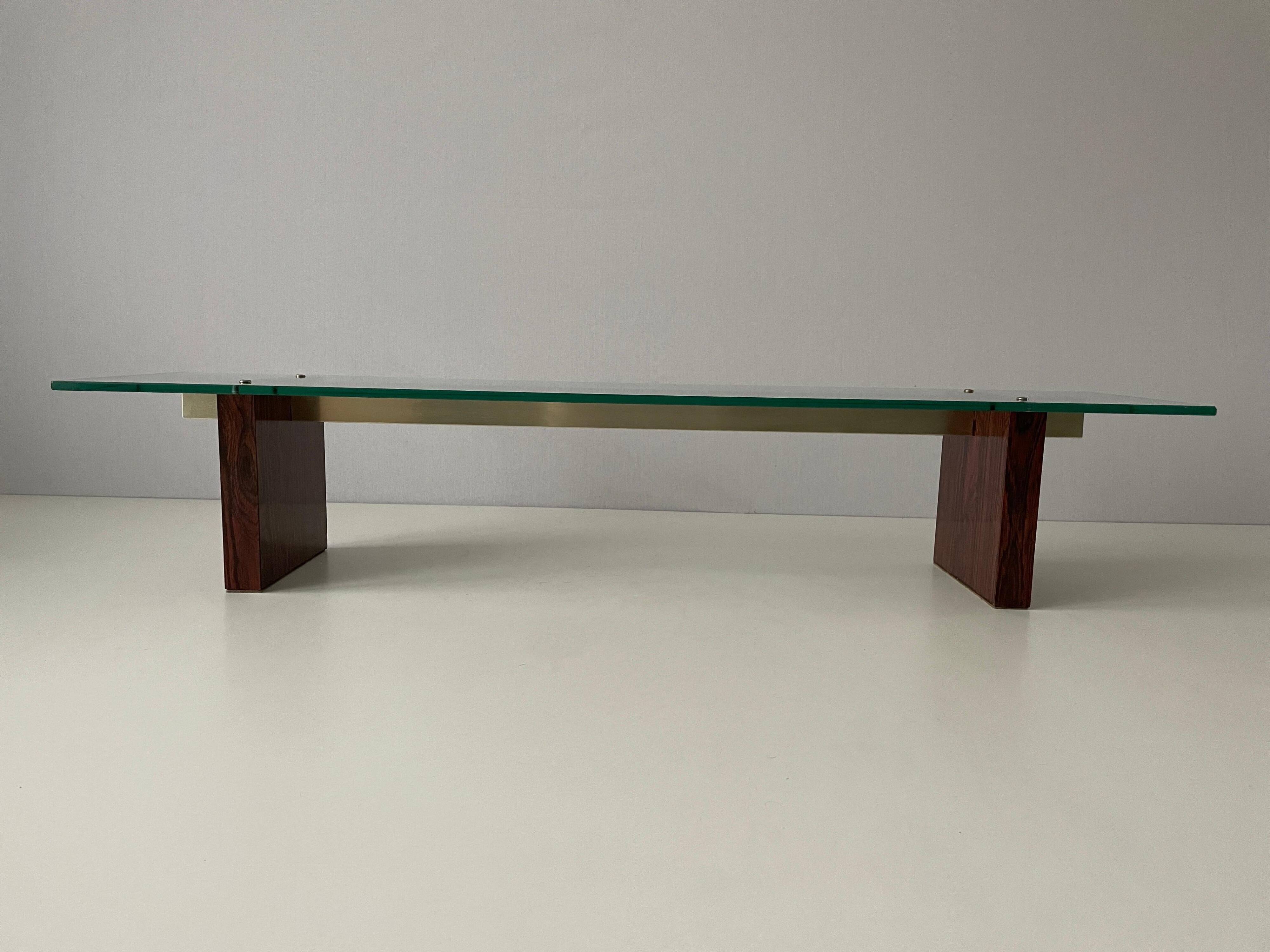 Mid-century minimalist thick glass coffee table, rosewood legs, 1960, Germany.