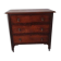 Antique oak chest of drawers on castors with brass handles and carved details