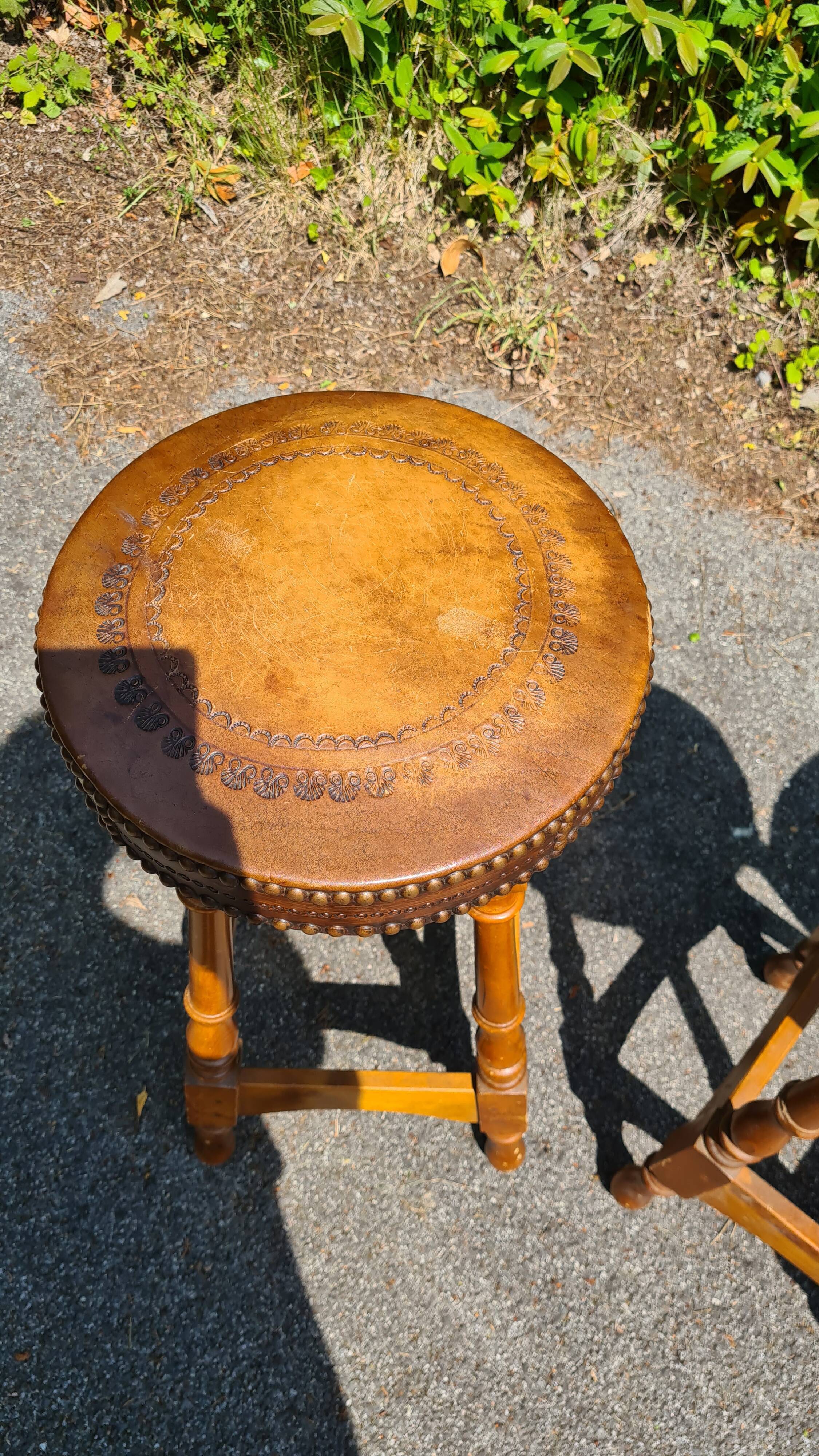 4 old leather and wood stools