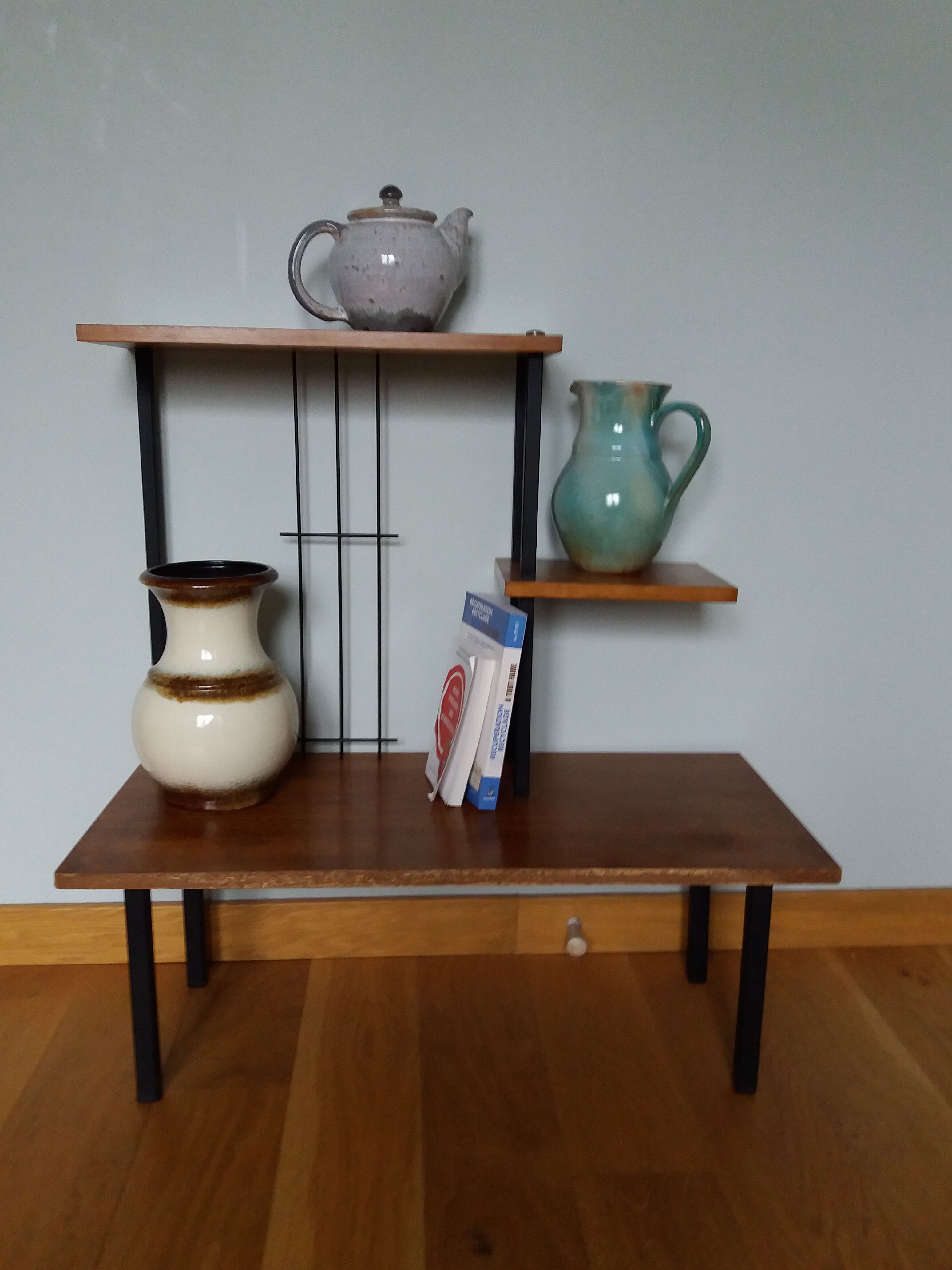 Shelf carries plants on feet modernist style